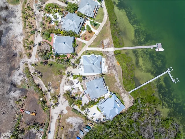 an aerial view of houses with outdoor space