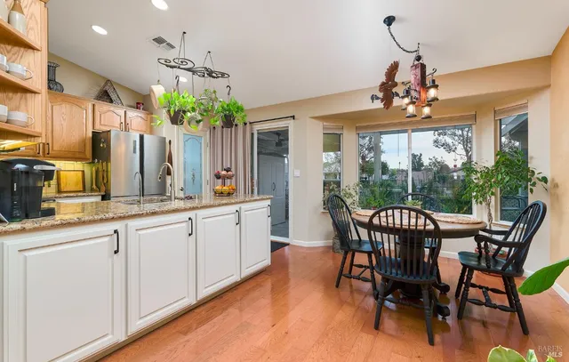 a view of a dining room with furniture window and wooden floor