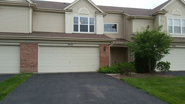 front view of a house and a yard