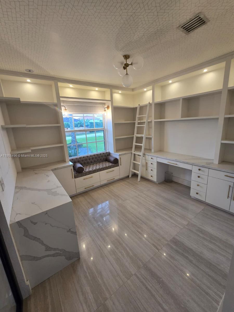 12944 Southwest 222nd Street Miami, FL 33170 - Photo 12 of 44 a view of a room with shelves
