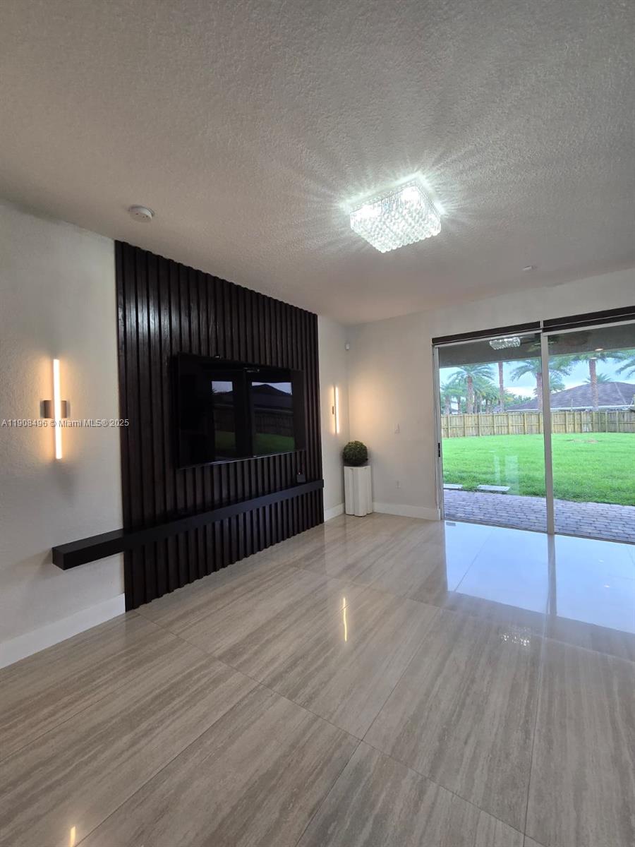 12944 Southwest 222nd Street Miami, FL 33170 - Photo 22 of 44 a view of entryway with wooden floor