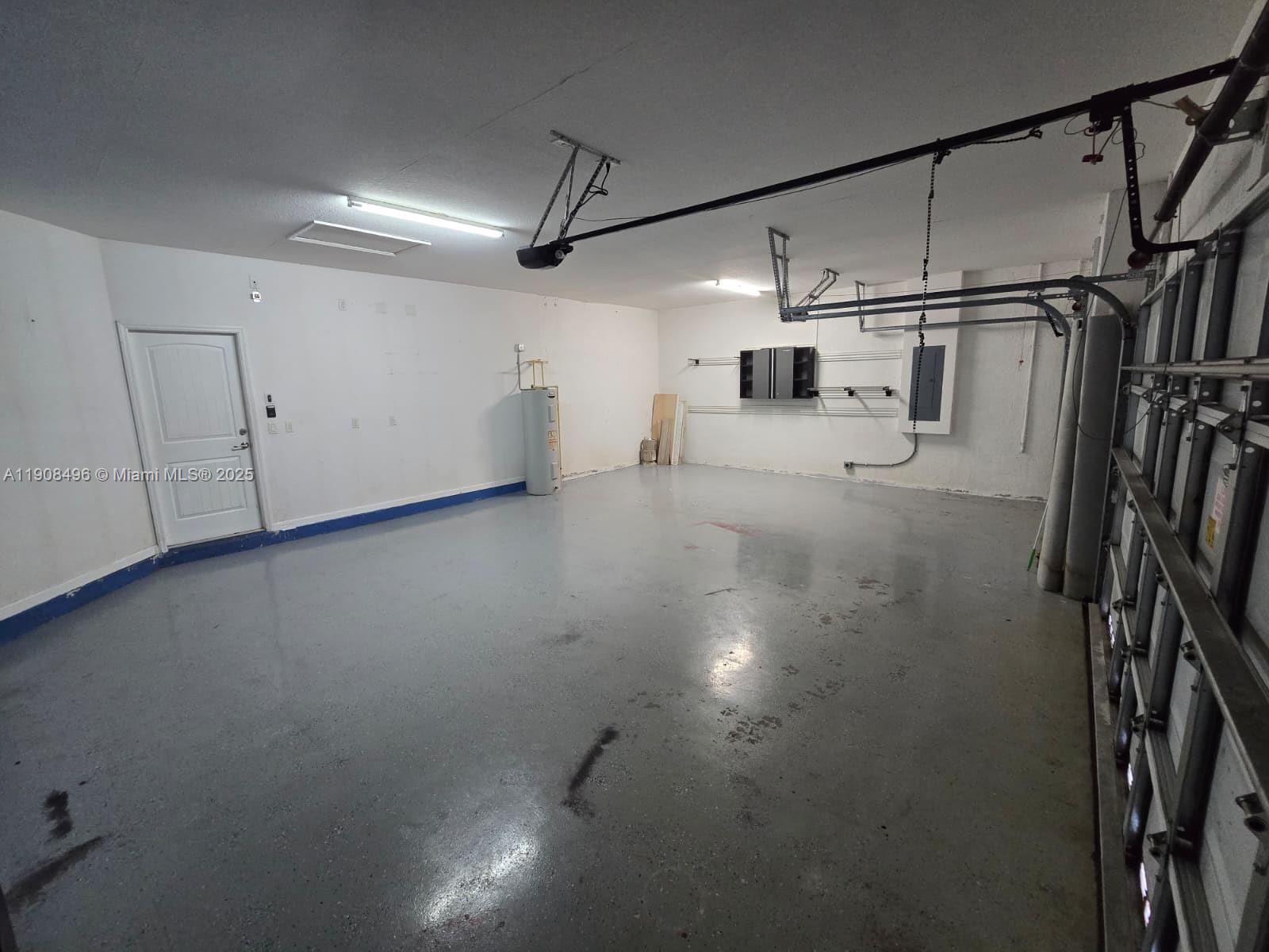 12944 Southwest 222nd Street Miami, FL 33170 - Photo 30 of 44 a view of a garage