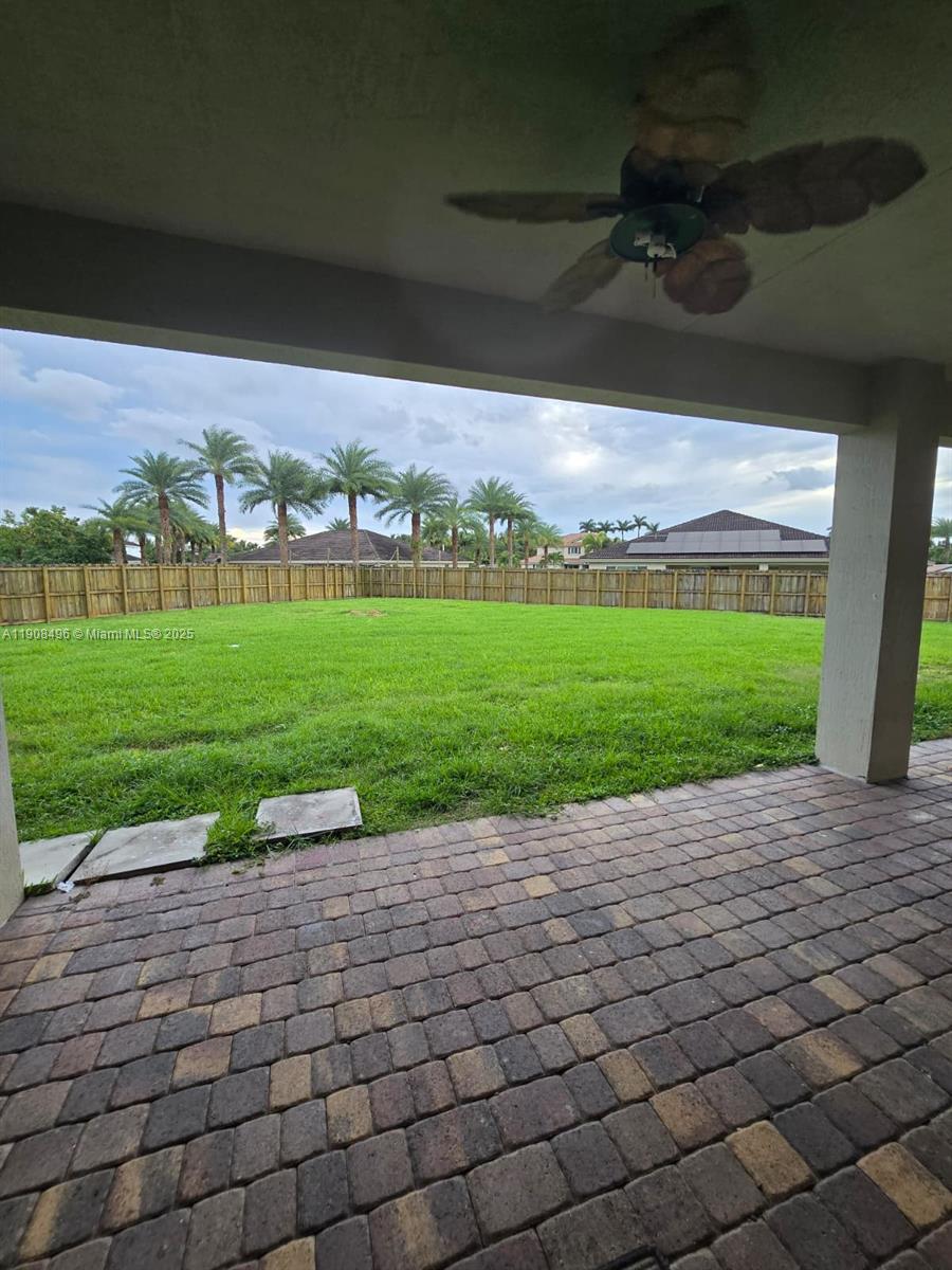 12944 Southwest 222nd Street Miami, FL 33170 - Photo 32 of 44 a view of a fountain in front of a house