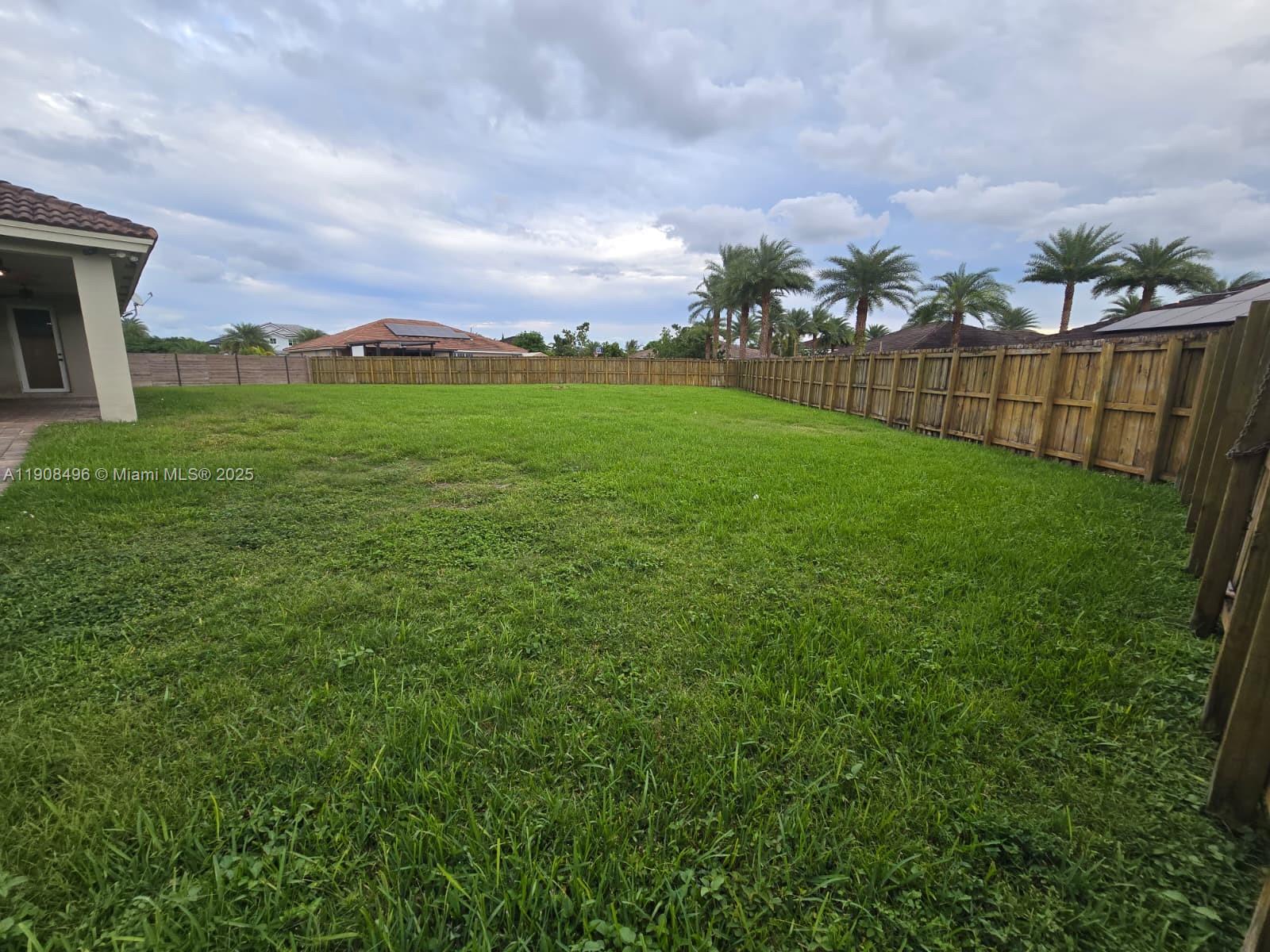 12944 Southwest 222nd Street Miami, FL 33170 - Photo 35 of 44 a view of a terrace with yard