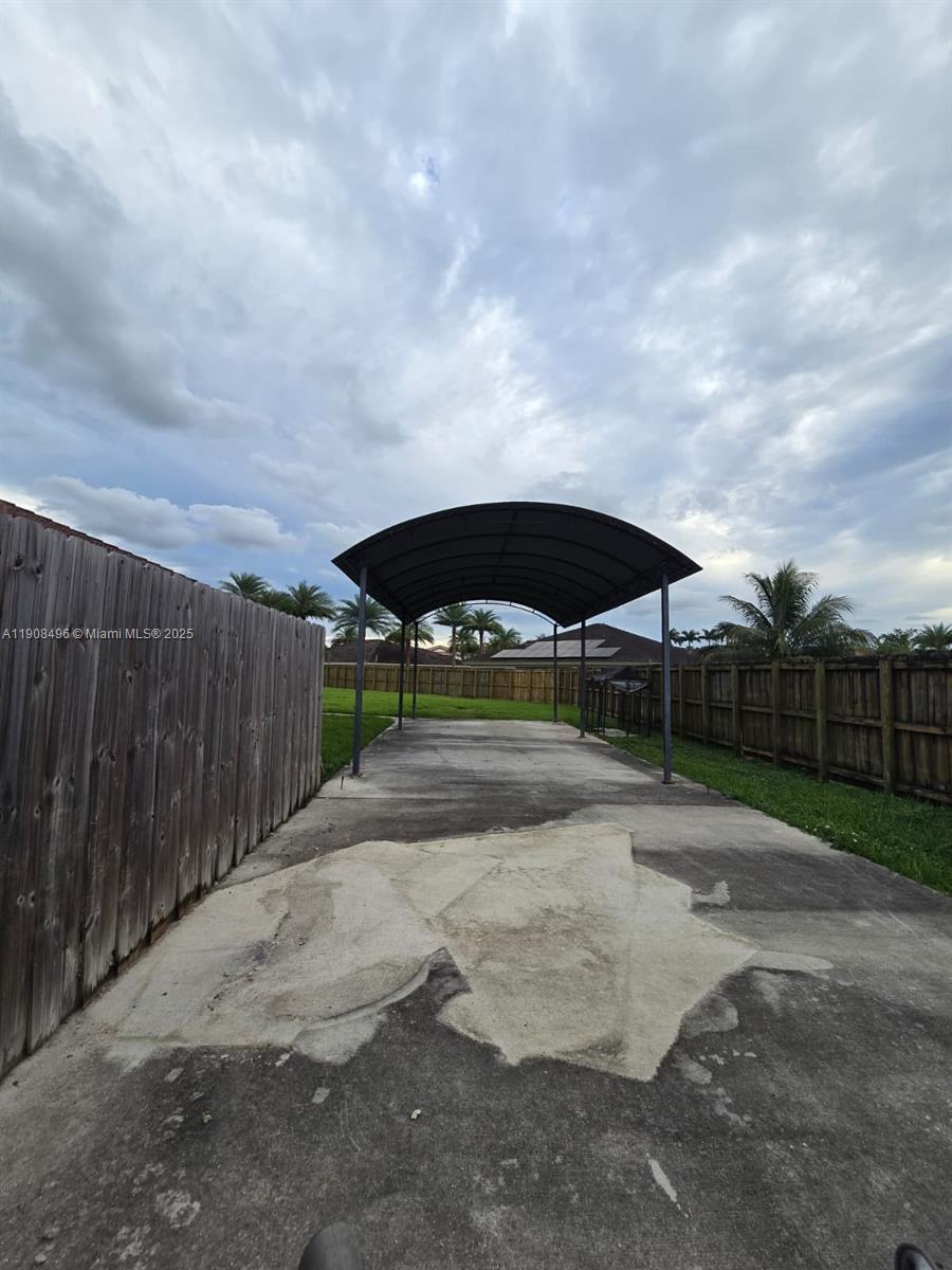 12944 Southwest 222nd Street Miami, FL 33170 - Photo 36 of 44 a view of backyard with trampoline