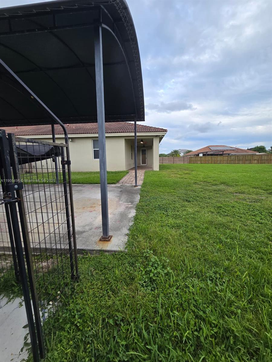 12944 Southwest 222nd Street Miami, FL 33170 - Photo 39 of 44 a view of a garden
