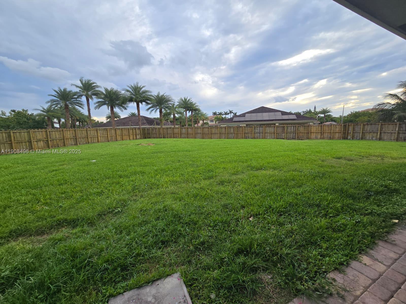 12944 Southwest 222nd Street Miami, FL 33170 - Photo 43 of 44 a view of an outdoor space and a yard