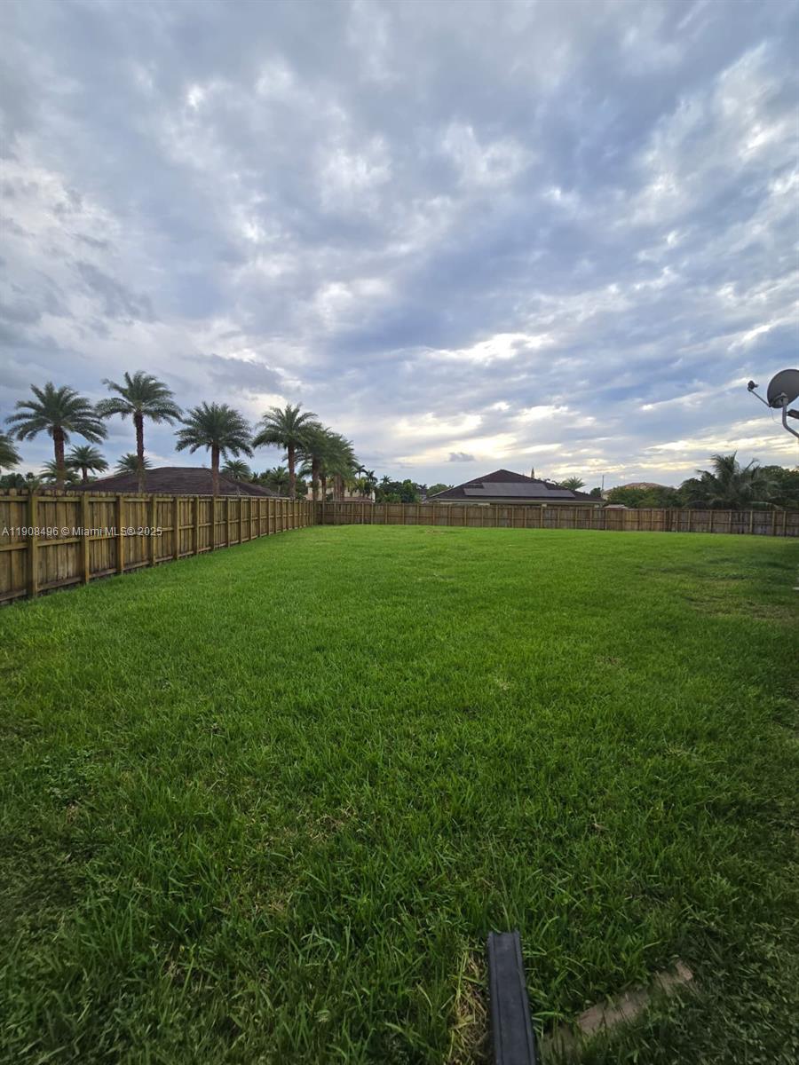 12944 Southwest 222nd Street Miami, FL 33170 - Photo 44 of 44 a view of a green field with sitting space