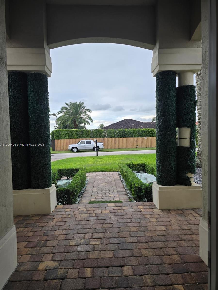 12944 Southwest 222nd Street Miami, FL 33170 - Photo 6 of 44 a view of building with garden