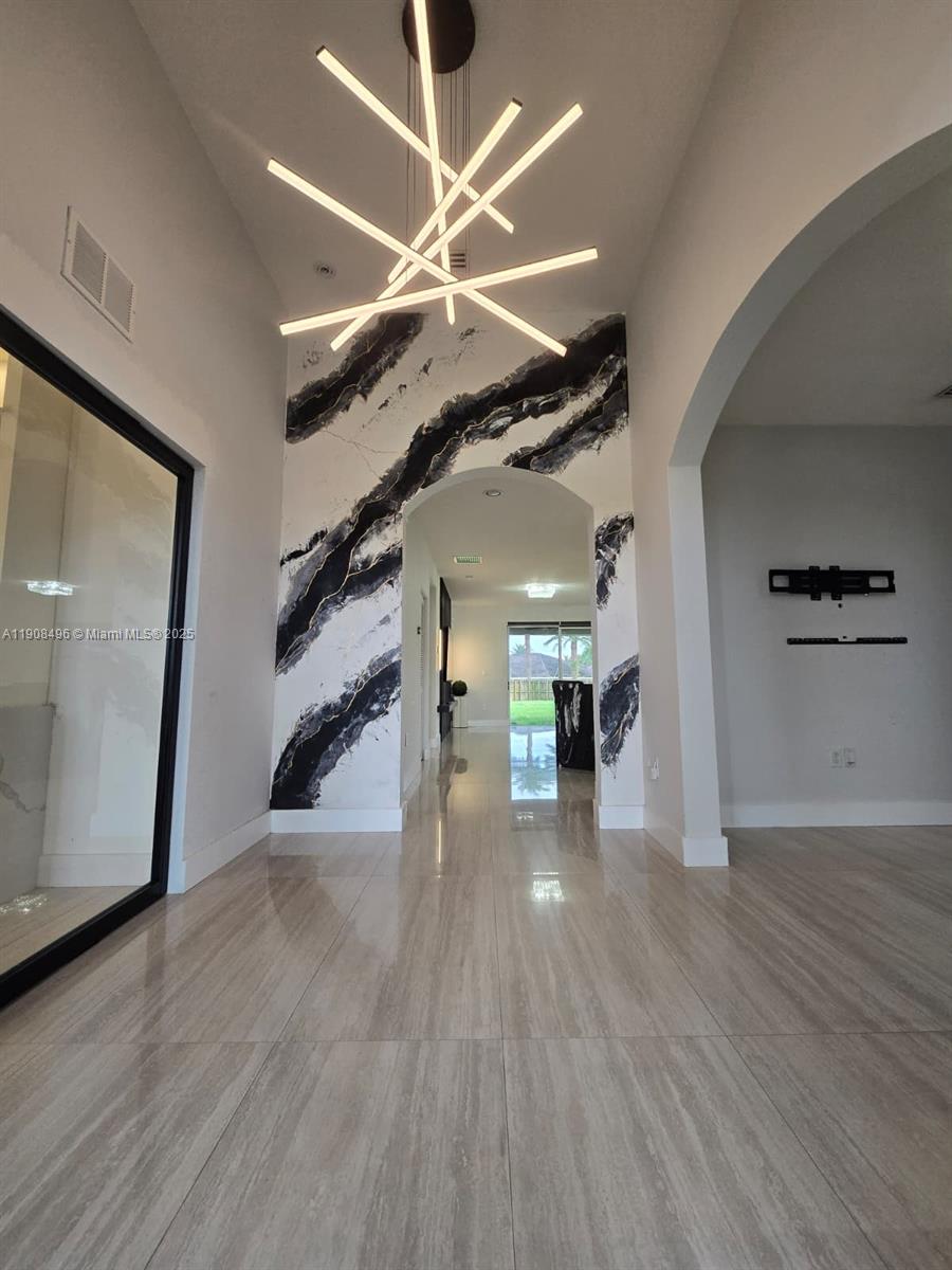 12944 Southwest 222nd Street Miami, FL 33170 - Photo 8 of 44 a view of a hallway with wooden floor