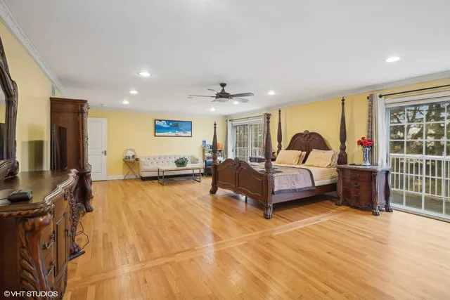a spacious bathroom with a tub sink and mirror