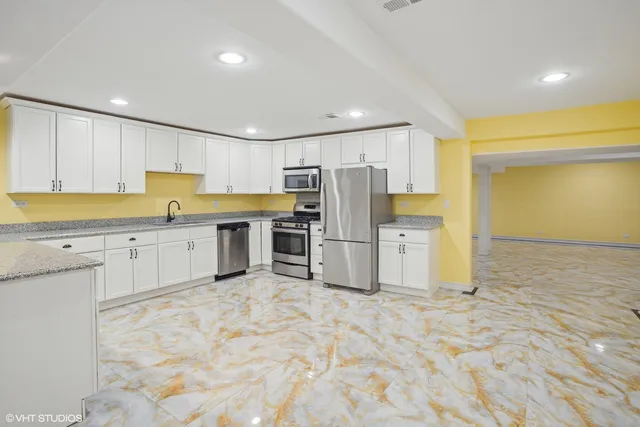 a spacious bedroom with a bed