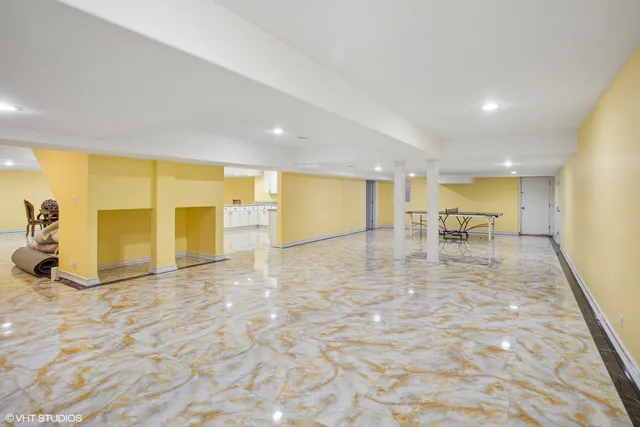 a bathroom with a granite countertop sink a toilet and shower