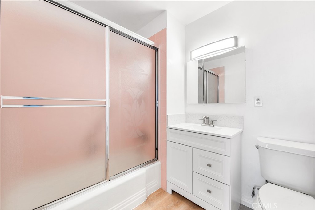 100 Atlantic Avenue, Unit 1005 Long Beach, CA 90802 - Photo 14 of 19 a bathroom with a toilet a sink and a mirror