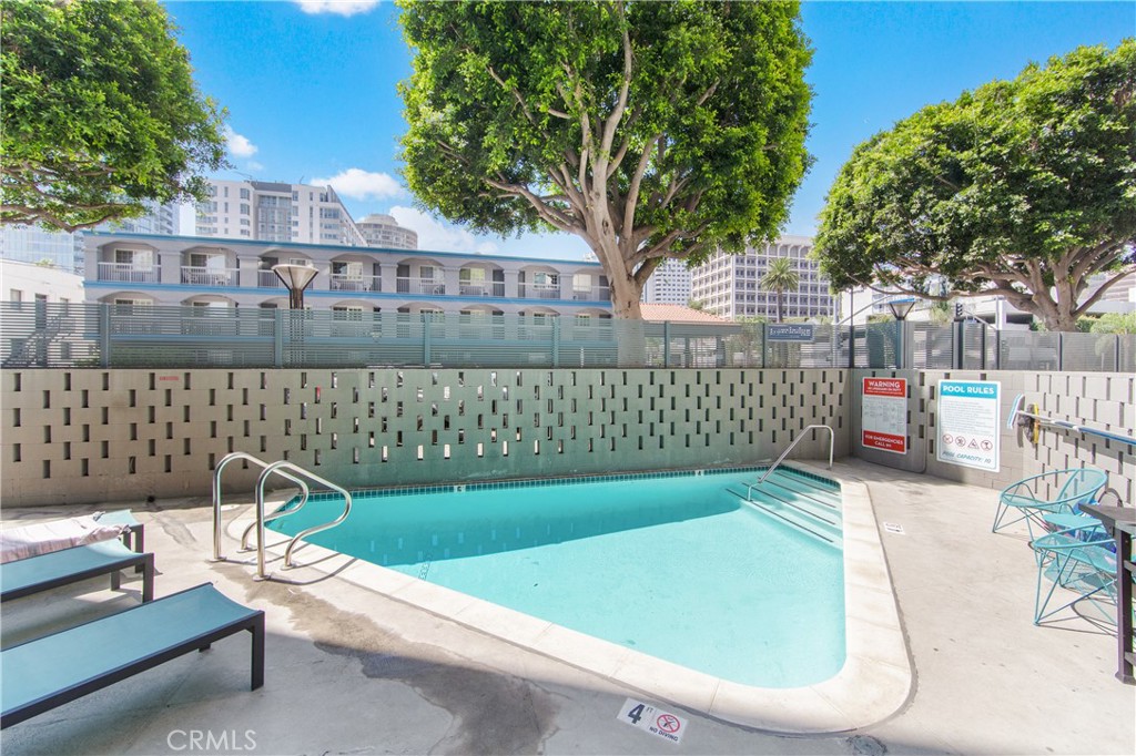 100 Atlantic Avenue, Unit 1005 Long Beach, CA 90802 - Photo 15 of 19 a view of a chairs and table in the back yard of the house
