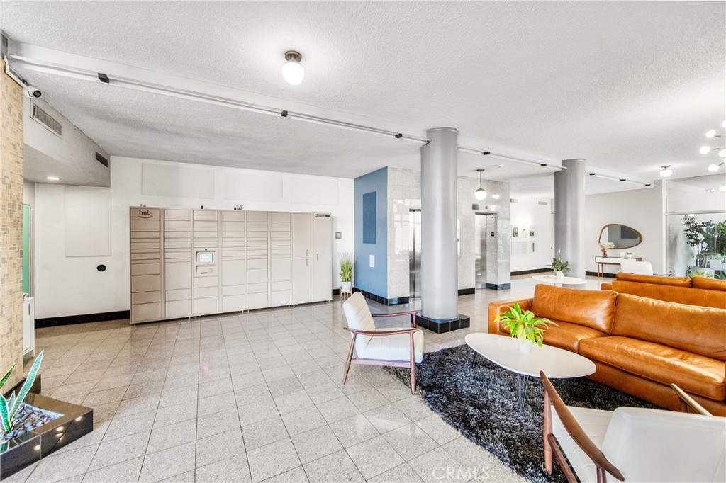 100 Atlantic Avenue, Unit 1005 Long Beach, CA 90802 - Photo 16 of 19 a living room with furniture and a rug