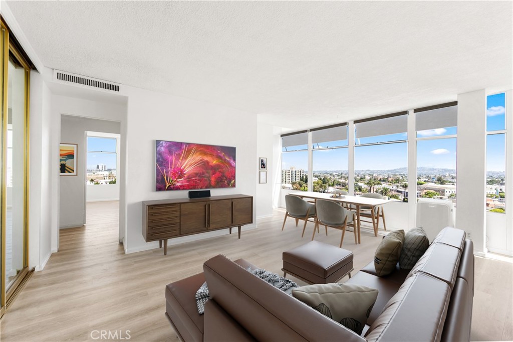 100 Atlantic Avenue, Unit 1005 Long Beach, CA 90802 - Photo 2 of 19 a living room with furniture and a flat screen tv
