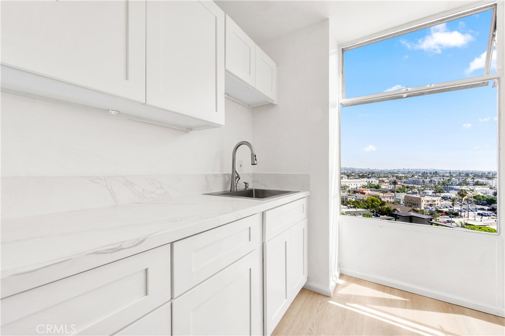 100 Atlantic Avenue, Unit 1005 Long Beach, CA 90802 - Photo 7 of 19 a kitchen with a sink and cabinets