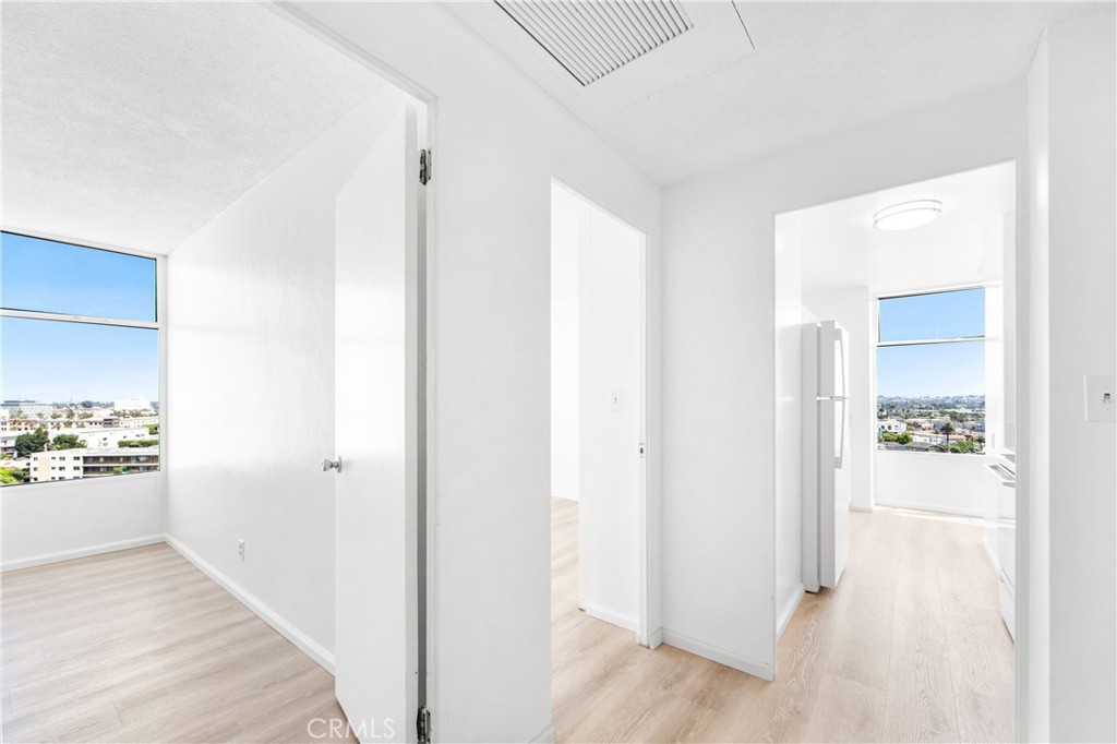100 Atlantic Avenue, Unit 1005 Long Beach, CA 90802 - Photo 8 of 19 a view of a hallway with closet and a living room