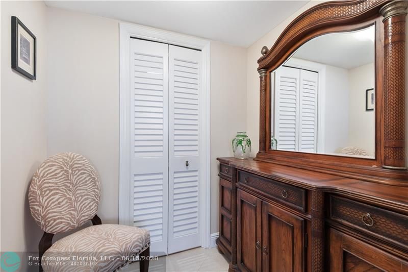3050 Northeast 47th Court, Unit 301 Fort Lauderdale, FL 33308 - Photo 12 of 19 a bedroom with a bed and a window