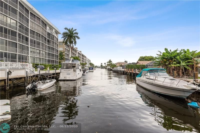 3050 Northeast 47th Court, Unit 301 Fort Lauderdale, FL 33308 - Photo 19 of 19 a view of a lake with a sitting space