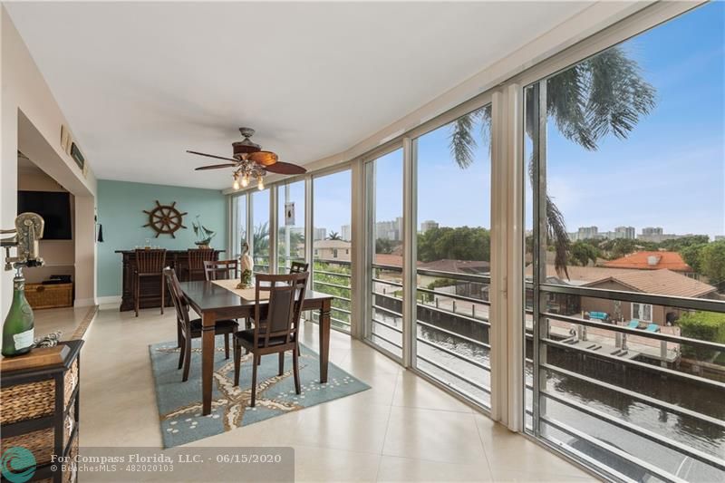 3050 Northeast 47th Court, Unit 301 Fort Lauderdale, FL 33308 - Photo 8 of 19 a view of a dining room with furniture window and outside view