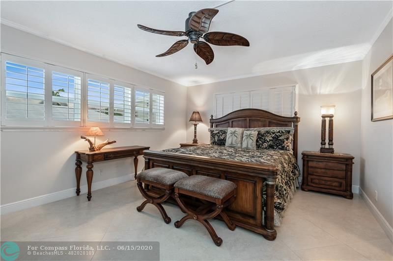 3050 Northeast 47th Court, Unit 301 Fort Lauderdale, FL 33308 - Photo 10 of 19 a view of a workspace with furniture and a window