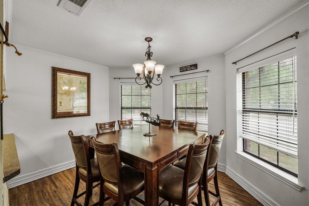 163 Granada Square Canton, TX 75103 - Photo 11 of 39 Dining area with bay window looking over the front yard.