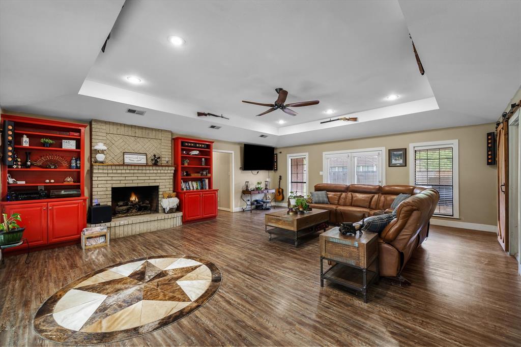 163 Granada Square Canton, TX 75103 - Photo 13 of 39 Beautiful brick fireplace surrounded by built-in cabinets.