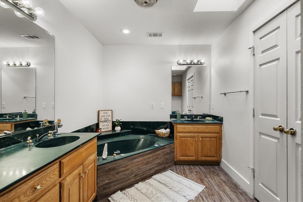 163 Granada Square Canton, TX 75103 - Photo 18 of 39 Ensuite with double vanity, garden tub & walk-in closer