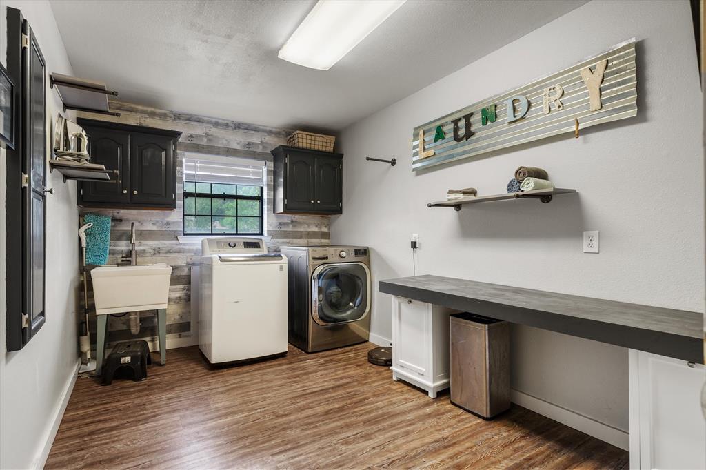 163 Granada Square Canton, TX 75103 - Photo 20 of 39 Storage, built-in ironing board, counterspace and sink