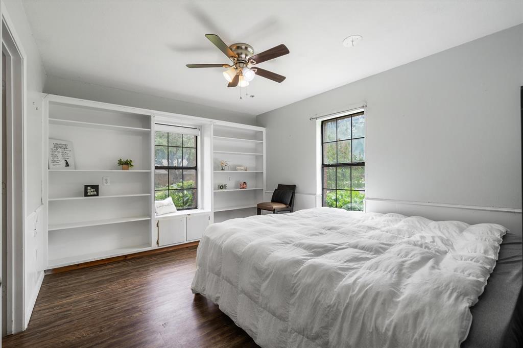 163 Granada Square Canton, TX 75103 - Photo 25 of 39 Light and airy, built-in shelving, window seat and walk-in closet. This room has its own ensuite bath. Perfect for multi-generational home.