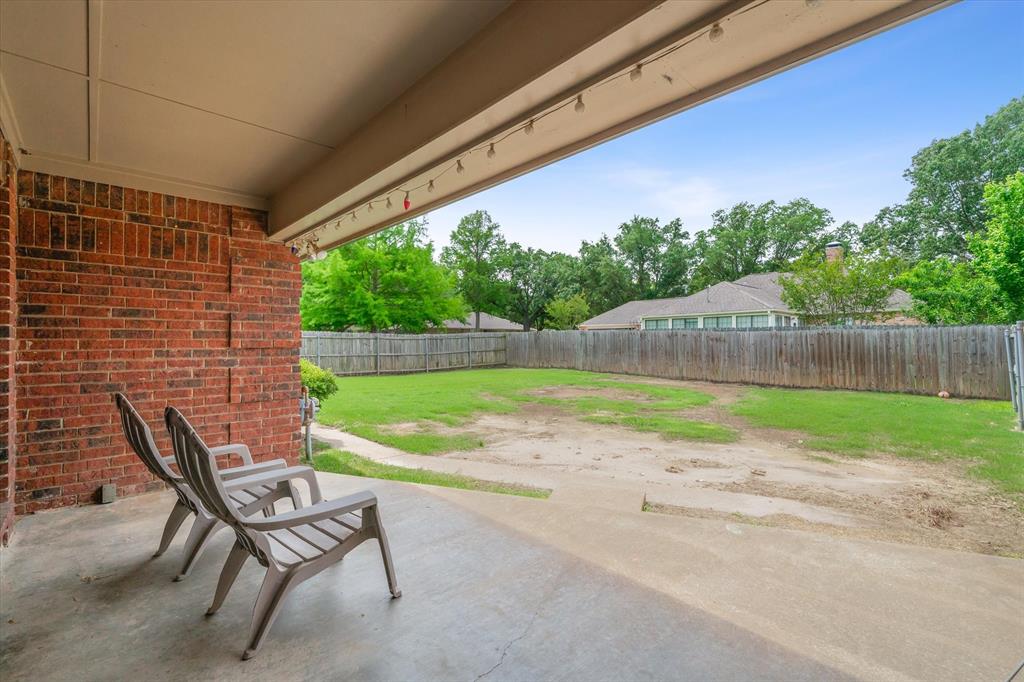 163 Granada Square Canton, TX 75103 - Photo 31 of 39 Private, covered patio looking over the fenced backyard