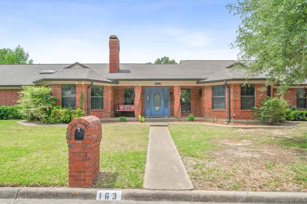 163 Granada Square Canton, TX 75103 - Photo 4 of 39 Striking, brick home welcomes large families and room for entertaining.