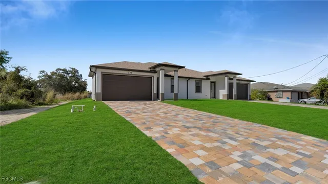 a front view of house with yard and green space