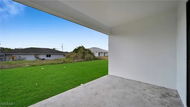 a view of a big house with a yard