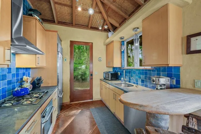 a kitchen with a sink and stove
