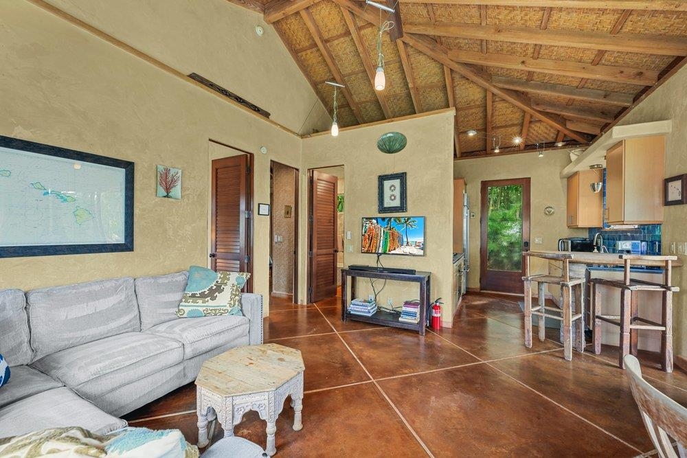 160 A Piialii Place Haiku, HI 96708 - Photo 10 of 22 a living room with lots of furniture and a large window