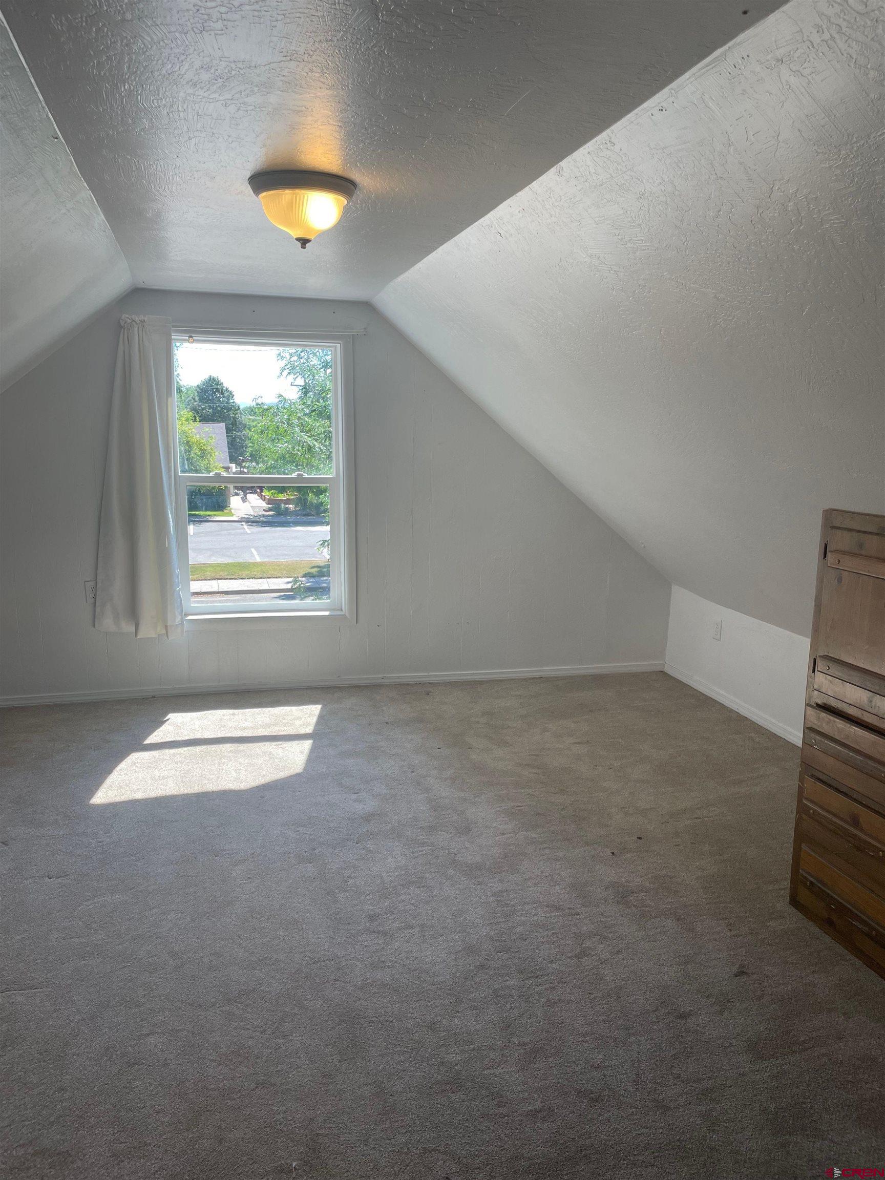 145 South Madison Street Cortez, CO 81321 - Photo 5 of 7 an empty room with a window