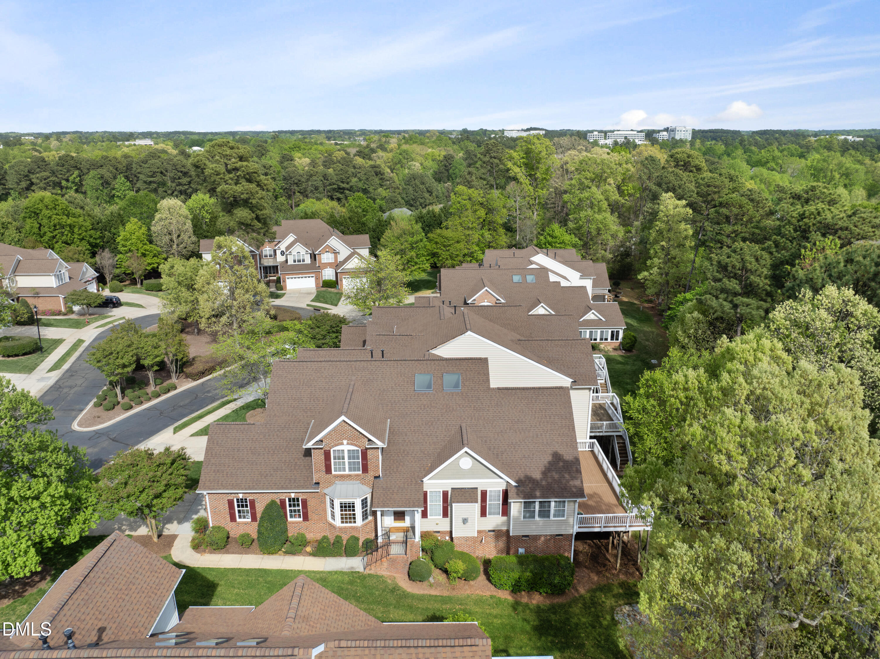an aerial view of residential houses with outdoor space and street view