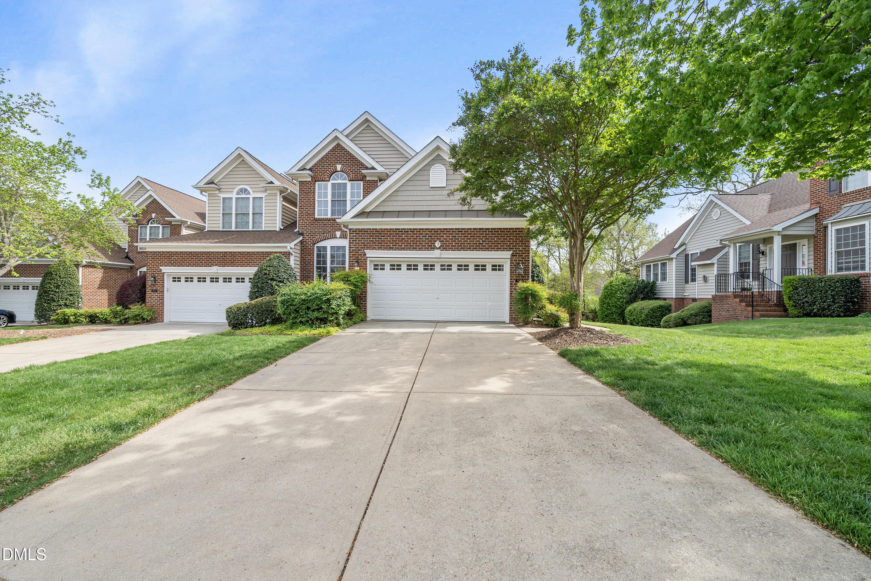 9125 White Eagle Court Raleigh, NC 27617 - Photo 2 of 44 a front view of a house with a yard and garage