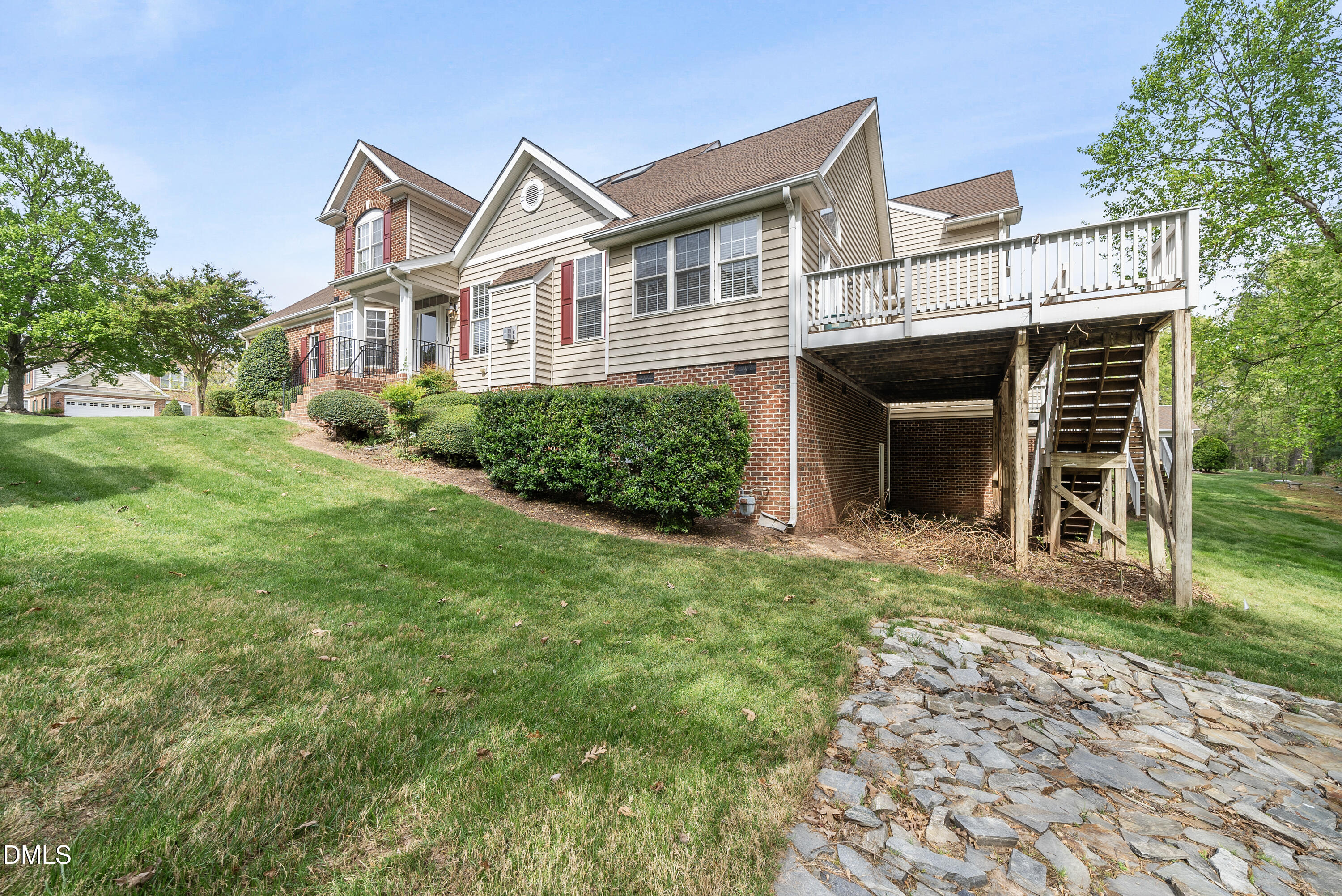 9125 White Eagle Court Raleigh, NC 27617 - Photo 3 of 44 a front view of a house with a yard and trees
