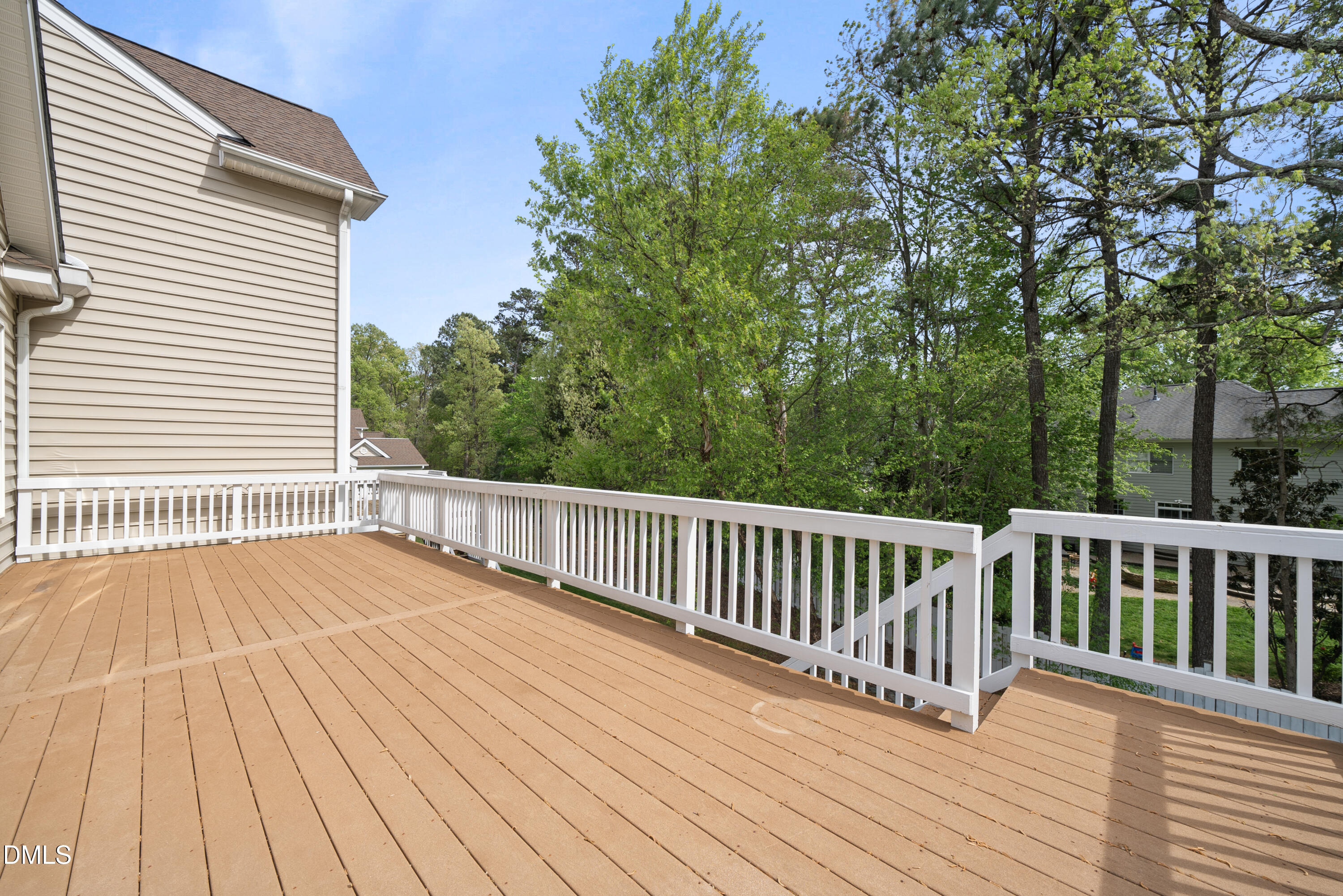 9125 White Eagle Court Raleigh, NC 27617 - Photo 4 of 44 a view of backyard with deck and wooden floor