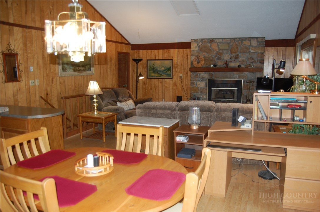 61 Dew Drop Loop Newland, NC 28657 - Photo 3 of 26 a living room with furniture fireplace and a large window