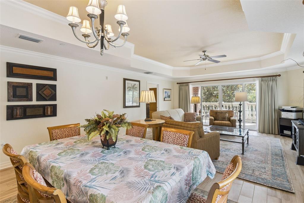 7650 Whisper Way, Unit 204 Reunion, FL 34747 - Photo 16 of 29 a view of a dining room with furniture window and outside view