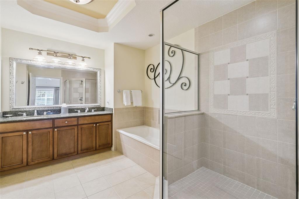 7650 Whisper Way, Unit 204 Reunion, FL 34747 - Photo 19 of 29 a bathroom with a bathtub and a sink