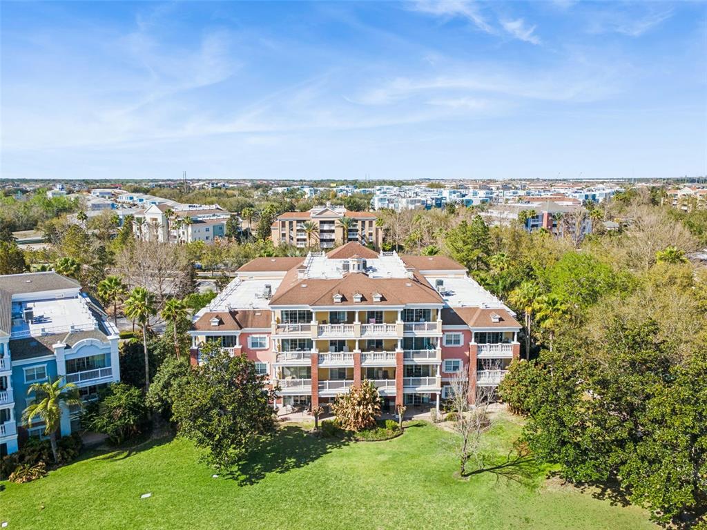 7650 Whisper Way, Unit 204 Reunion, FL 34747 - Photo 2 of 29 an aerial view of a house with a garden