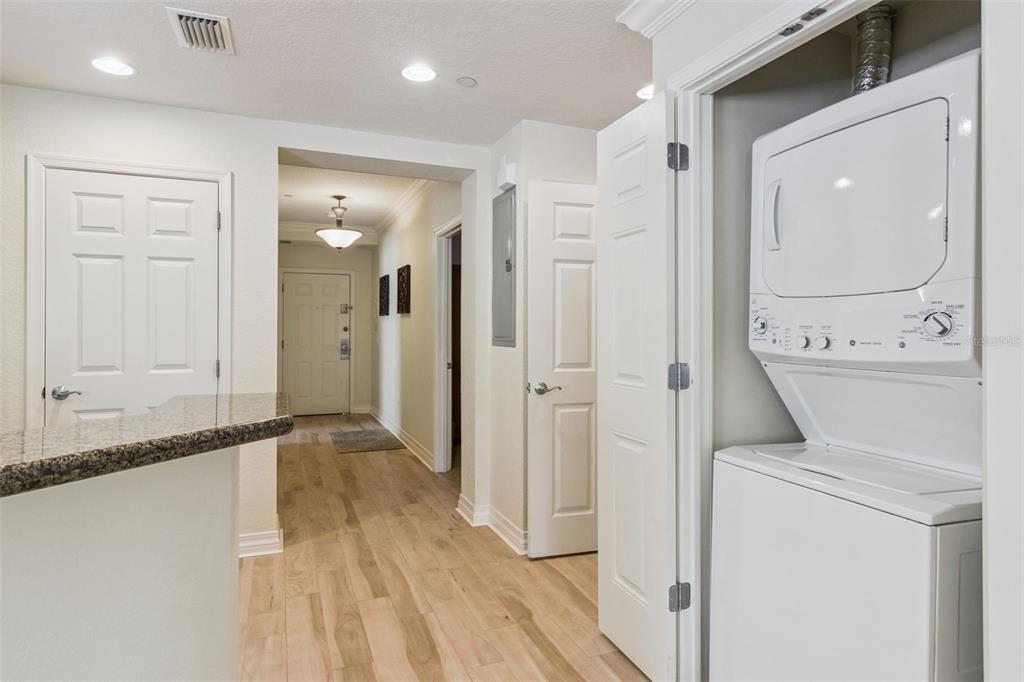 7650 Whisper Way, Unit 204 Reunion, FL 34747 - Photo 21 of 29 a view of a hallway with wooden floor and staircase
