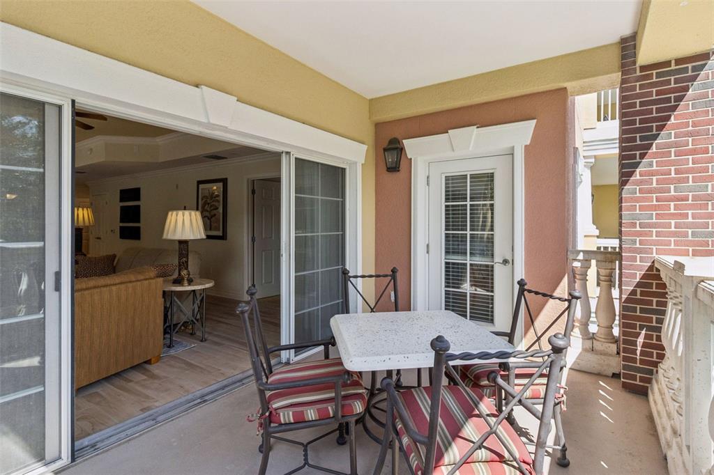 7650 Whisper Way, Unit 204 Reunion, FL 34747 - Photo 22 of 29 a view of a dining room with furniture and windows
