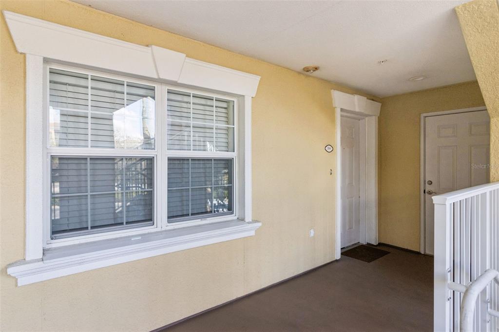 7650 Whisper Way, Unit 204 Reunion, FL 34747 - Photo 3 of 29 a view of empty room with windows